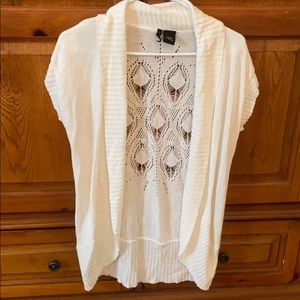 Short sleeved cardigan with cut out back.